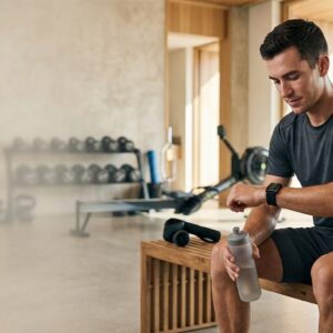 Black Whoop 4.0 fitness wearable device on a wrist tracking athletic recovery.